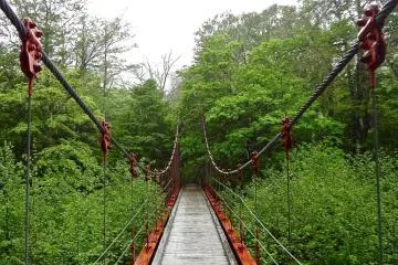 This small red bridge crosses a river on the way to the lake.