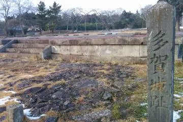 <p>Looking towards the center of the castle. The marker on the right reads Taga&nbsp;Castle Ruins</p>