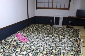 <p>Our room was more than big enough to accommodate three futons, plus a small table (not in the picture).&nbsp;</p>