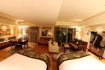 <p>A view of my opulent room as seen from between the two majestic and western style beds, you can see the mirror in the front which is actually a TV as well.&nbsp;</p>