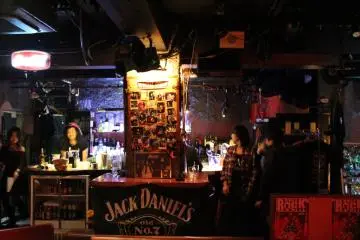 <p>Performers double as staff during breaks from the stage</p>