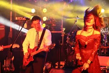 <p>Finding his confidence, he looks like a member of the band</p>