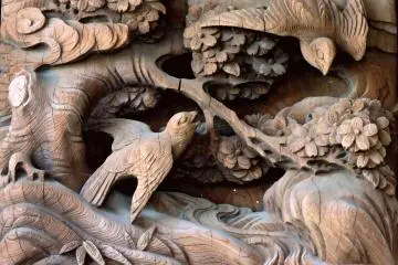 <p>Several carved wooden scenes feature birds</p>