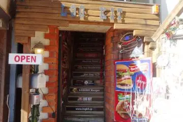 <p>The restaurant is located on the second floor of what is supposed to remind you of a log cabin</p>
