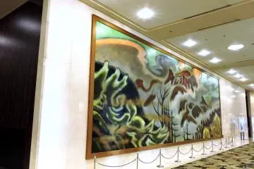 <p>A big painting on the wall of a corridor</p>