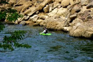 <p>Lone kayaker in a tiny kayak</p>