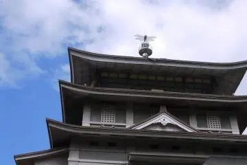 A dragonfly perches on this concrete reconstruction of Otsu Castle.