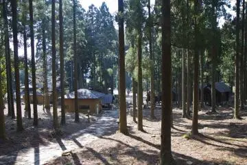 <p>View of the shrine, washrooms, and cabins from the tent area</p>