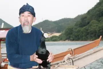 A cormorant master and his cormorant (Photo: Hessel Anne Domingo)