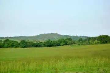 <p>Across the meadow, you can see the radar observatory of Mt. Monomi</p>