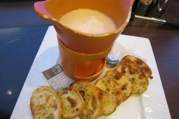 <p>A fragrant cheese fondue with browned garlic toast</p>