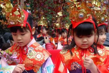 <p>Young girls board floats for the opening parade of Yanagawa's Hina&nbsp;festivities</p>