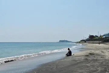 A surfer taking a break from the waves.