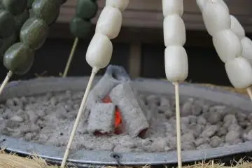 <p>Mochi (rice cakes) on sticks</p>