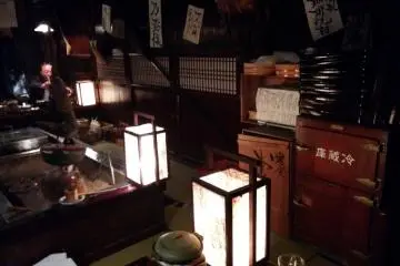 <p>Lanterns and an old wooden refrigerator</p>