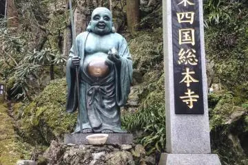 <p>Une statue de Hotei, la divinit&eacute; du bonheur et de la satisfaction</p>