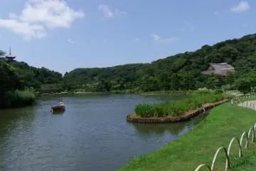 A boat on the lake with pagoda in background