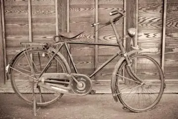 A bicycle parked outside one of the houses at the Edo Tokyo Museum