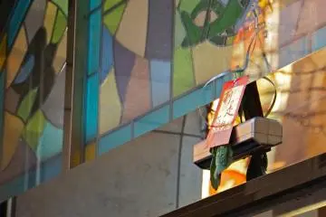 <p>Merchants hang lucky red envelopes along with Chinese cabbage at the entrance to their shop for good luck, joy, fortune, and happiness for the New Year.</p>