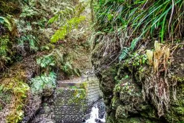 <p>A closer look at this river and concrete stairs in the background show where the bridge once stood</p>