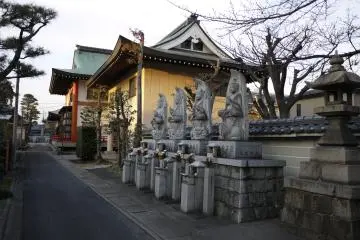 <p>Statues line the path that is the main entrance</p>