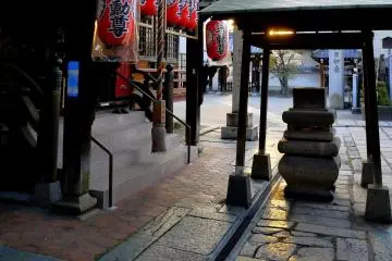 <p>Yellow light shining on uneven flagstones</p>
