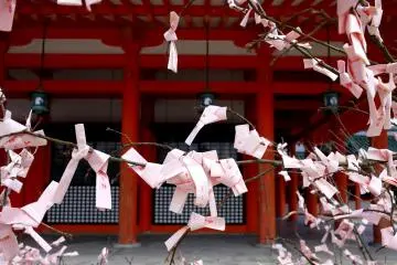 In spring the shrine has pink omikuji (fortune papers)