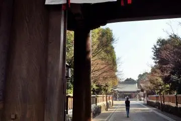 <p>Looking through the main gate toward the shrine. The grounds are meticulously groomed.</p>