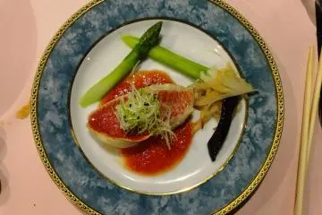 <p>A plate of fresh fish and vegetables was just one of the many dinner courses</p>