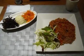 <p>Tomato risotto, made with brown rice and served with a selection of salads. Dessert is also included.</p>