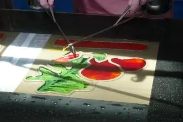 Dye being poured onto the fabic