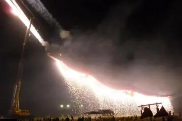 Ryujin is lit up with fireworks whilst shooting more fireworks out his mouth!