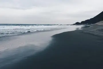<p>The beach in front of the resort is relaxing and beautiful, even on a cloudy, wet day.</p>