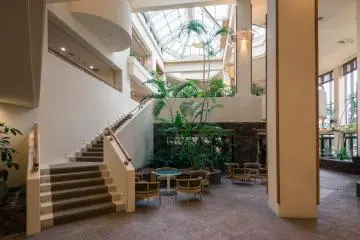 <p>The inside of the hotel is just as beautiful as the outside, with classy design and lots of natural light. This is the lounge area, around which the restaurants can be found. &nbsp;</p>