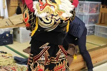 <p>Trying on some of the clothes myself in the practice room</p>