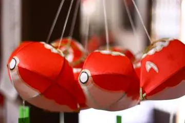 <p>Unfinished lanterns hang inside Masae-san's shop</p>