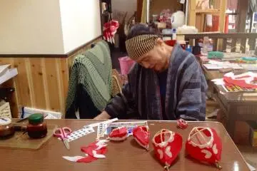 <p>Masae-san with some of her lanterns</p>