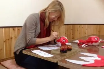 <p>Deep in concentration as I paint my lantern</p>