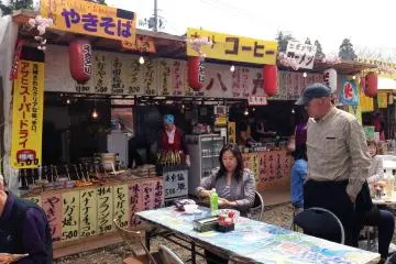 Try some Yakisoba fried noodles and enjoy the open air fun fair atmosphere at the stalls.