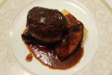<p>A hamburg steak made from locally sourced venison</p>