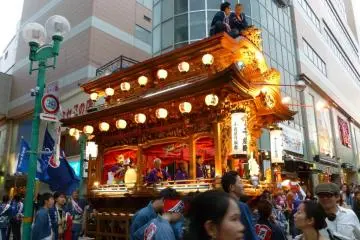 Two men sitting atop one of the floats. (Photo: N.Skoulding)
