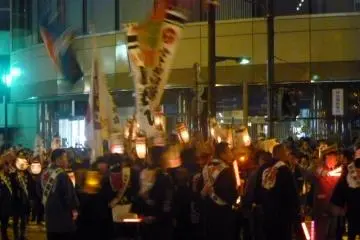 People circling and cheering waving flags