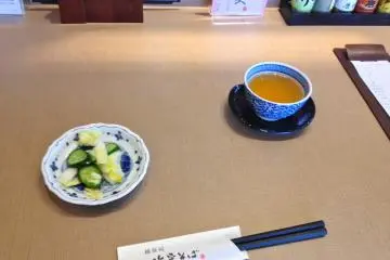 <p>Salt pickled cabbage and cucumber (tsukemono) and tea</p>