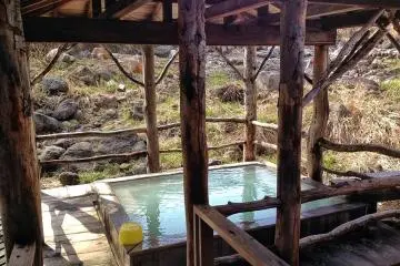 <p>There's mixed gender bathing available here, as well as separate baths for men and women, so don't be shy! This is the mixed outdoor bath, which is lit up softly at night and is a great place to relax, surrounded by nature.</p>