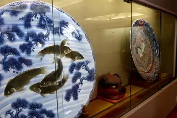 <p>Japanese porcelain plates on display</p>