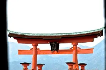 <p>View of the torii gate as seen through the mouth of a lantern</p>