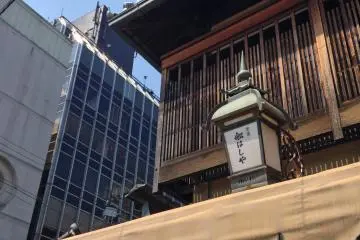 <p>Funahashiya is overshadowed by modern offices next door</p>