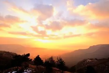 <p>Though a little bit misty and blurry, the rising sun viewed from outer craters of Mt. Aso was mysterious and beautiful.</p>