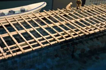 <p>Model of bamboo float with oyster nets suspended beneath</p>
