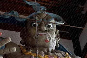<p>Giant Nio statue guarding the temple gate</p>